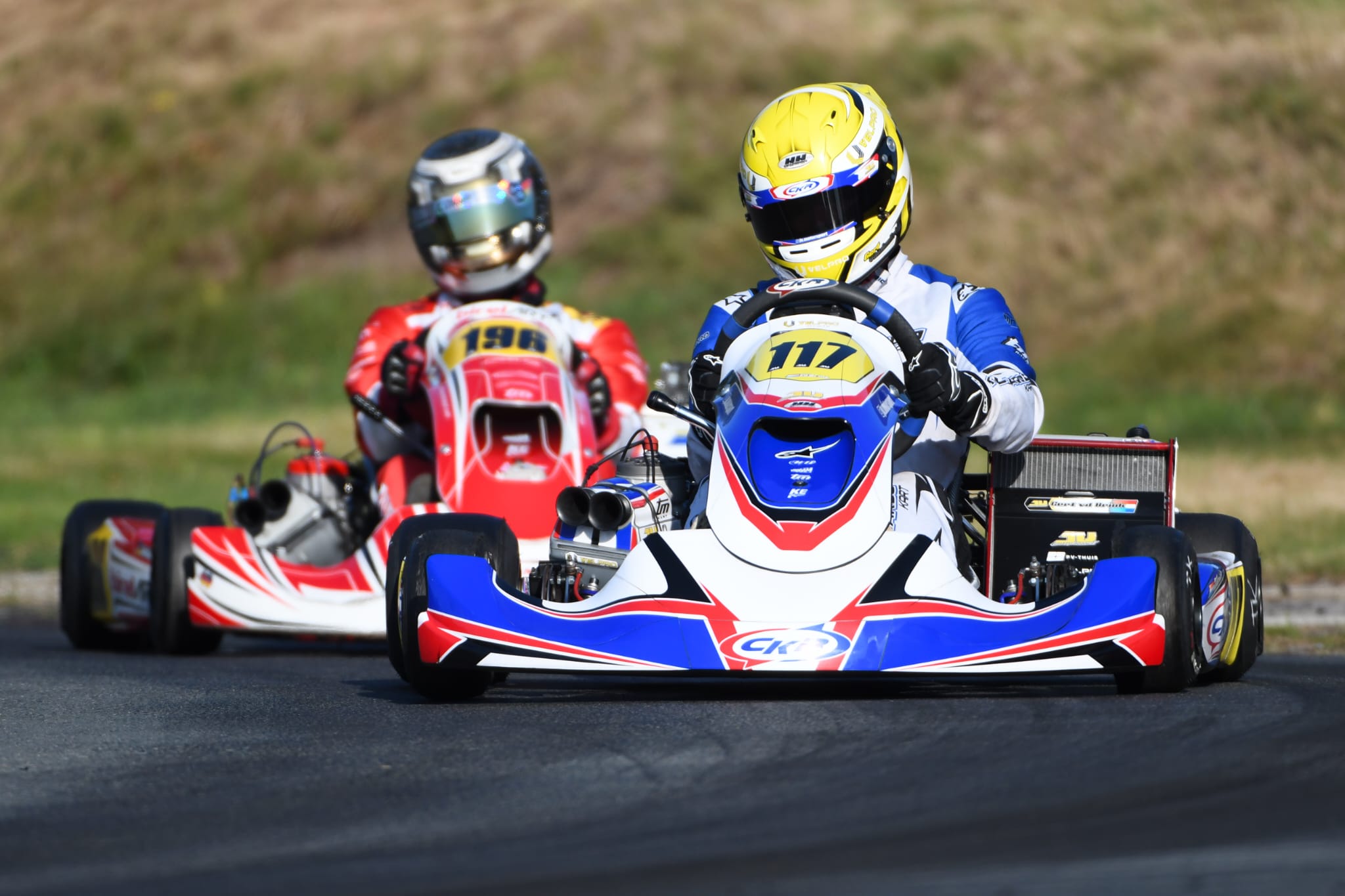 Two racing karts on the track at speed